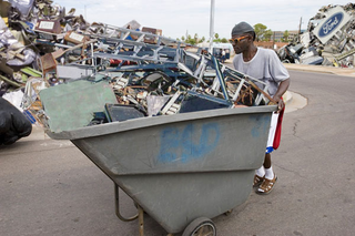 Scrap dealer Vernon Mills pledged he would not "miss out on a good deal" as he hauled away what's left of Detroit's East Side.